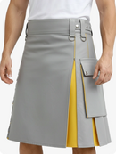 Gray and yellow kilt worn by a person on a white background