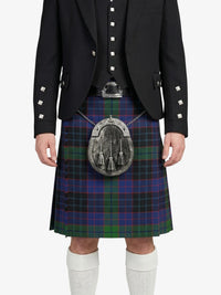 Person wearing a Scottish kilt with a tartan pattern on a white background
