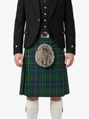 Person wearing a traditional Scottish kilt with a black jacket on a white background