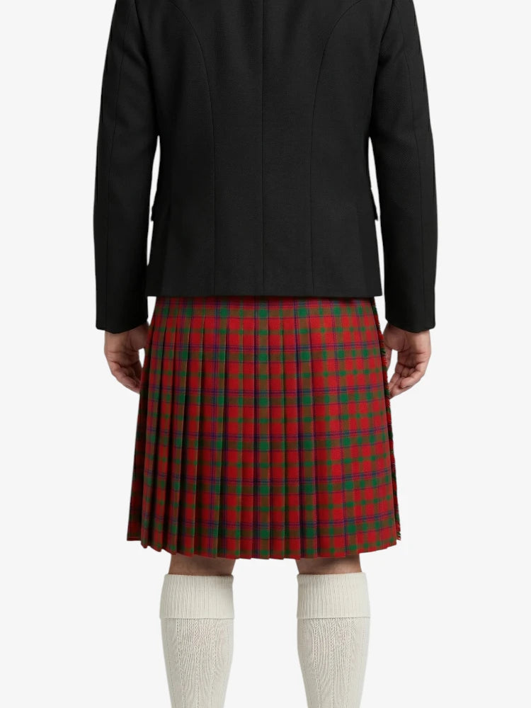 Person wearing a black jacket and red plaid kilt on a white background