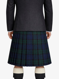 Person wearing a dark gray jacket and a green plaid kilt on a white background