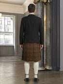 Person wearing a black jacket and plaid kilt in an elegant room with marble columns.