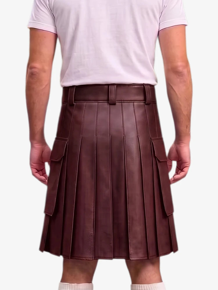 A person shown from the back wearing a dark brown pleated leather kilt with side cargo pockets, paired with a light pink t-shirt and white socks, against a plain light gray background.