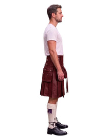 A man shown in profile wearing a dark red leather kilt with silver-toned metal hardware, a white t-shirt, white knee-high socks, and black leather shoes, set against a plain white background.