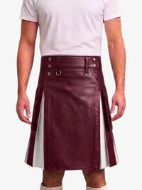 A maroon faux-leather kilt with white side panels and silver-tone hardware, modeled with a white t-shirt against a light gray background.