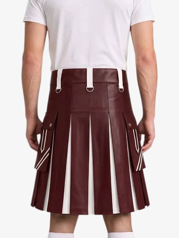 A man wearing a pleated faux-leather kilt in burgundy with white vertical stripe panels and white belt loops, paired with a white t-shirt, shown from the back against a light gray background.