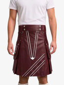 A maroon faux-leather kilt with white geometric stripe patterns, worn by a model in a white t-shirt against a light gray background.