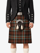 Person wearing a traditional Scottish kilt with a tartan pattern on a white background