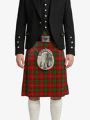Person wearing a red tartan kilt with a black jacket on a white background