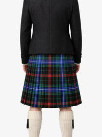Person wearing a black jacket and plaid kilt on a white background