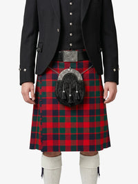 Person wearing a red and green plaid kilt with a black jacket on a white background