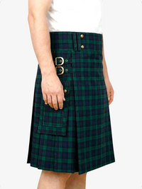 Green plaid kilt worn by a person on a white background