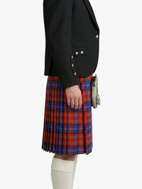 Person wearing a black jacket and red, blue, and green plaid kilt on a white background