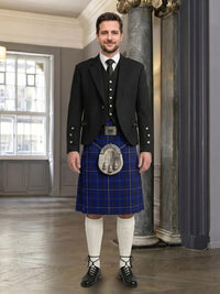 Man wearing a traditional Scottish kilt in an elegant interior setting