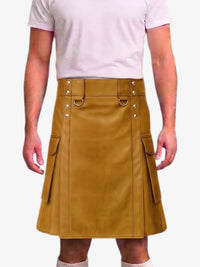 A mustard yellow faux-leather kilt with silver-tone metal hardware, worn by a model in a light pink t-shirt against a plain white background.