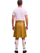 A man shown from the back wearing a mustard yellow leather kilt, a light pink t-shirt, white knee-high socks, and black shoes, isolated on a white background.