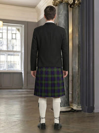 Man wearing a dark jacket and plaid kilt in an indoor setting.
