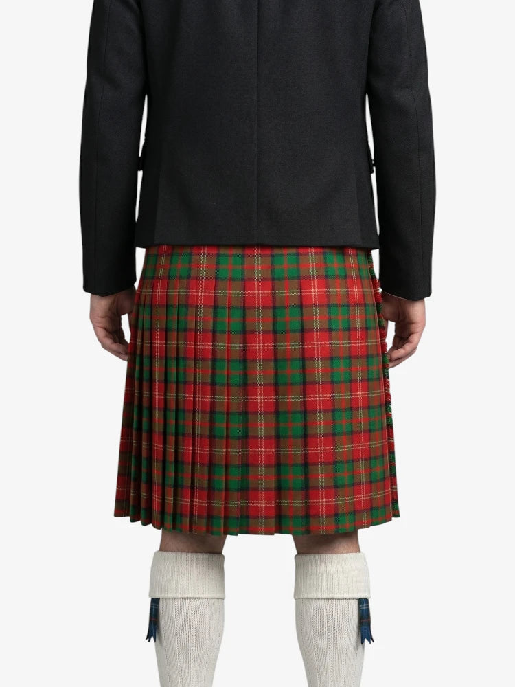 Person wearing a red and green plaid kilt on a white background