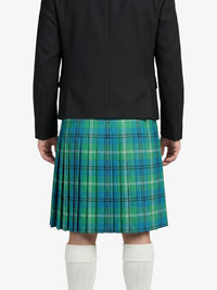 Person wearing a black jacket and blue plaid kilt on a white background