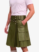 An olive green faux-leather kilt with a matching belt, silver-tone hardware, and large cargo pockets, shown on a model wearing a white t-shirt against a light gray background.