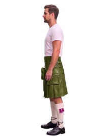 A man shown in profile wearing a green leather kilt with multiple flap pockets and buckles, a white t-shirt, white knee-high socks with a purple accent, and black leather shoes, against a plain white background.