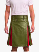 A model wearing a green faux-leather kilt with red side panels and silver-tone hardware, paired with a white t-shirt and white socks, against a plain white background.