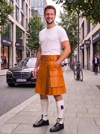 A man standing on a city sidewalk wearing a bright orange-brown leather kilt with a matching belt, a white t-shirt, white knee-high socks, and black leather shoes. A Mercedes-Benz car and urban buildings are visible in the background.