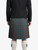 Person wearing a black jacket and a plaid kilt on a white background