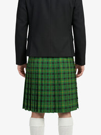 Person wearing a green plaid kilt with a black jacket on a white background