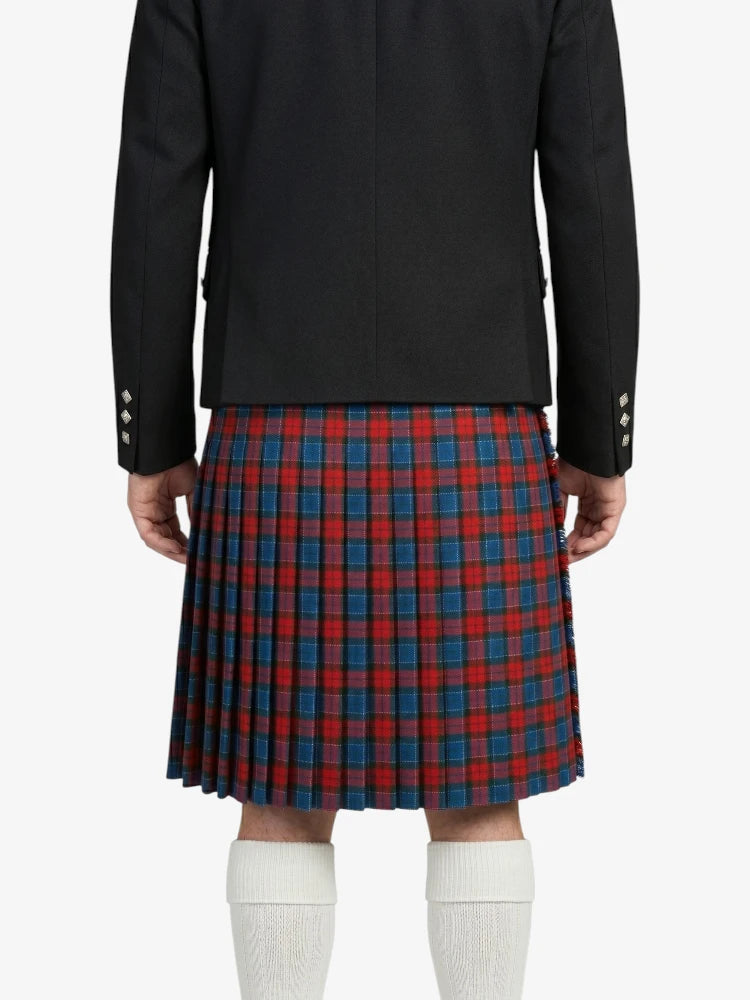 Person wearing a black jacket and red plaid kilt on a white background