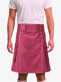 A person wearing a dusty rose pink faux-leather kilt with silver-tone metal hardware, shown from the chest down against a light gray background.