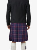 Person wearing a black jacket and plaid kilt on a white background