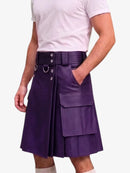 A person wearing a purple faux-leather kilt with a matching belt, silver hardware, and cargo pockets, paired with a light pink t-shirt against a plain white background.