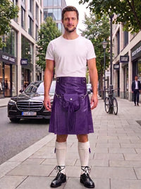 A man stands on a city sidewalk wearing a purple leather kilt with a white t-shirt, white knee-high socks, and black shoes. The background shows a street with buildings, a black Mercedes-Benz car, and a bicycle.