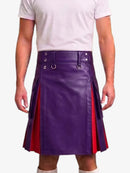 A person wearing a purple faux-leather kilt with red side panels and silver metal hardware, paired with a white t-shirt against a light gray background.