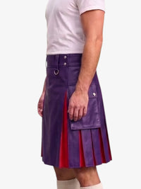 A man wearing a purple faux-leather kilt with red pleated lining and silver hardware, paired with a white t-shirt and white socks, shown from the chest down against a light gray background.