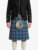 Person wearing a black jacket and blue plaid kilt with a silver sporran on a white background