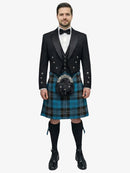 Man wearing a traditional Scottish ramsay blue tartan kilt with a black prince charlie jacket and bow tie on a white background