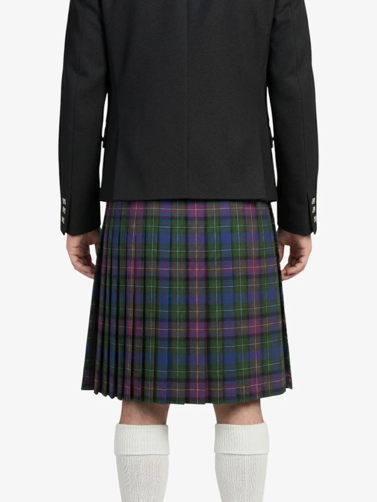 Person wearing a black jacket and plaid kilt on a white background