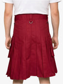 Red pleated skirt worn by a person on a white background
