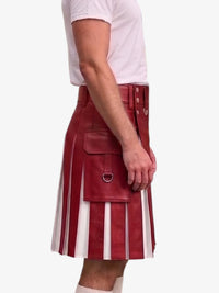 A person wearing a red leather kilt with vertical white stripe panels and front utility pockets, paired with a white t-shirt, shown against a plain light gray background.