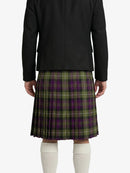 Person wearing a black jacket and green plaid Kilt on a white background