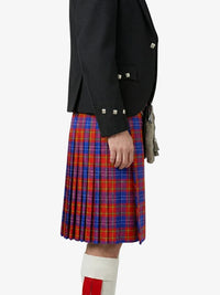 Person wearing a black jacket and red plaid kilt on a white background