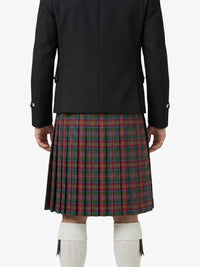 Person wearing a black jacket and red plaid kilt on a white background