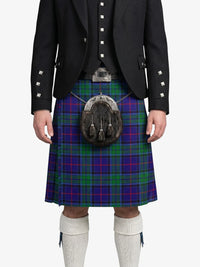 Person wearing a traditional Scottish kilt with a tartan pattern on a white background