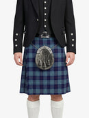 Person wearing a black jacket, blue plaid kilt, and white socks on a white background