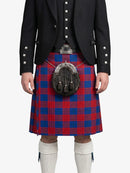 Person wearing a black jacket and red and blue plaid kilt on a white background
