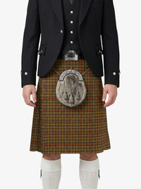 Traditional Scottish kilt with a dark jacket and white socks on a white background