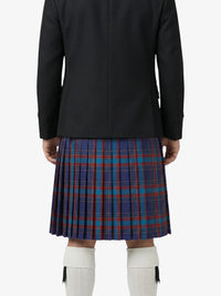 Person wearing a black coat and blue plaid kilt on a white background