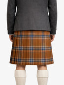 Person wearing a gray blazer and brown plaid kilt on a white background